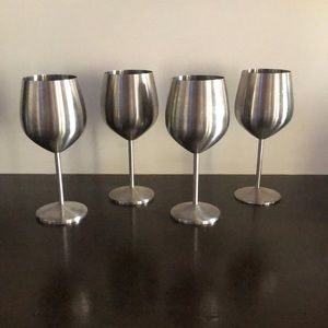 Four stainless steel wine glasses.